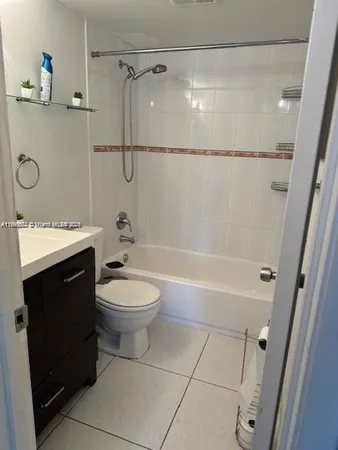 a bathroom with a toilet sink and shower