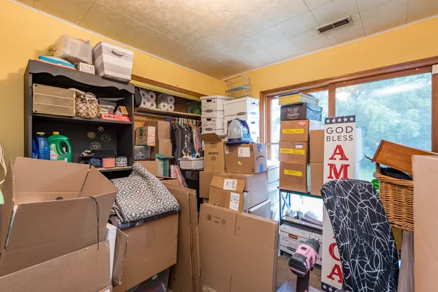 a view of outdoor sitting area with furniture and a shower
