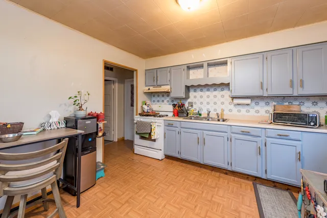 a kitchen with a sink and cabinets
