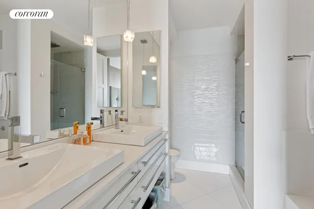 a bedroom with furniture and a large window