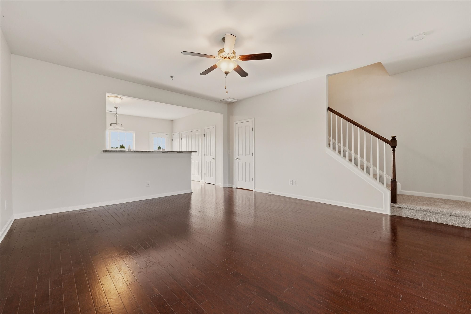 2050 Hemlock Drive Spring Hill, TN 37174 - Photo 8 of 48 a view of a livingroom with wooden floor and a ceiling fan