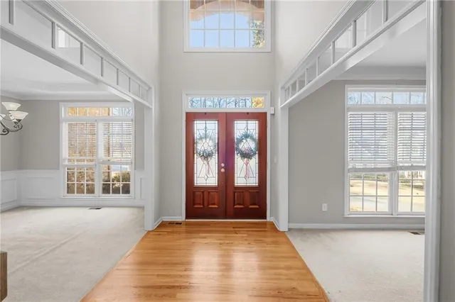 a spacious bathroom with a tub sink and mirror