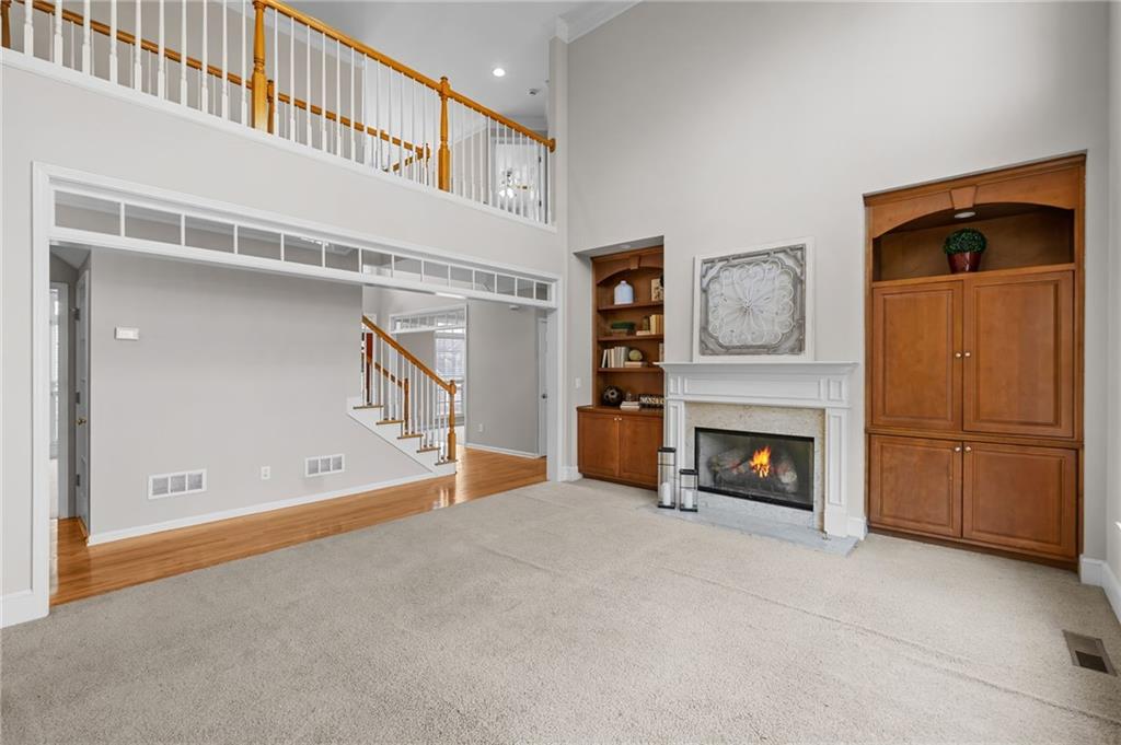 403 Glenhurst Trace Canton, GA 30115 - Photo 20 of 73 a view of an empty room with window and a fireplace