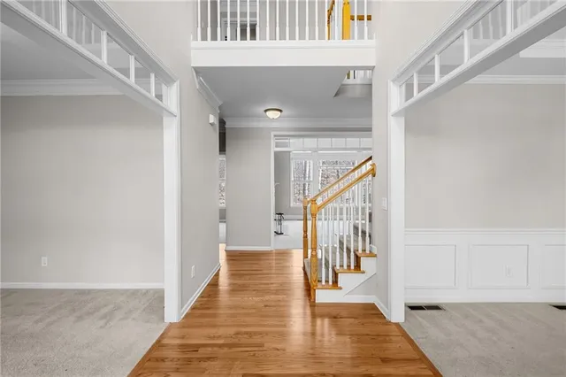 a view of a garden with a house in the background
