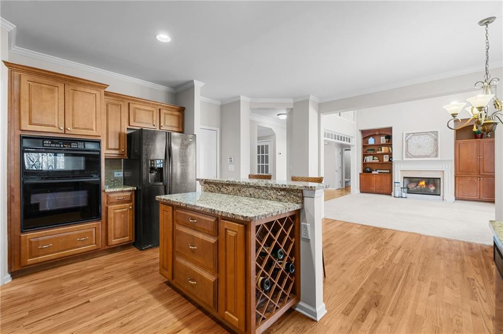 403 Glenhurst Trace Canton, GA 30115 - Photo 26 of 73 a kitchen with stainless steel appliances granite countertop a stove refrigerator and a wooden floors