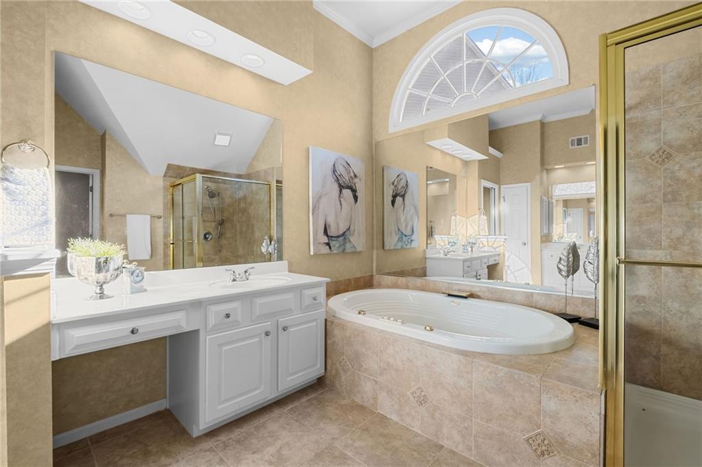 403 Glenhurst Trace Canton, GA 30115 - Photo 35 of 73 a spacious bathroom with a tub sink and mirror