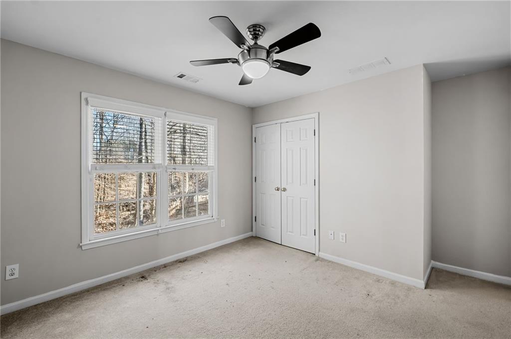 403 Glenhurst Trace Canton, GA 30115 - Photo 43 of 73 a view of an empty room with a window