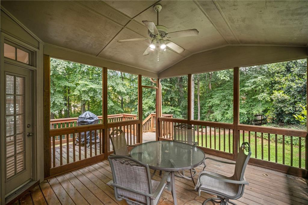 403 Glenhurst Trace Canton, GA 30115 - Photo 57 of 73 a view of a dining room with furniture window and wooden floor