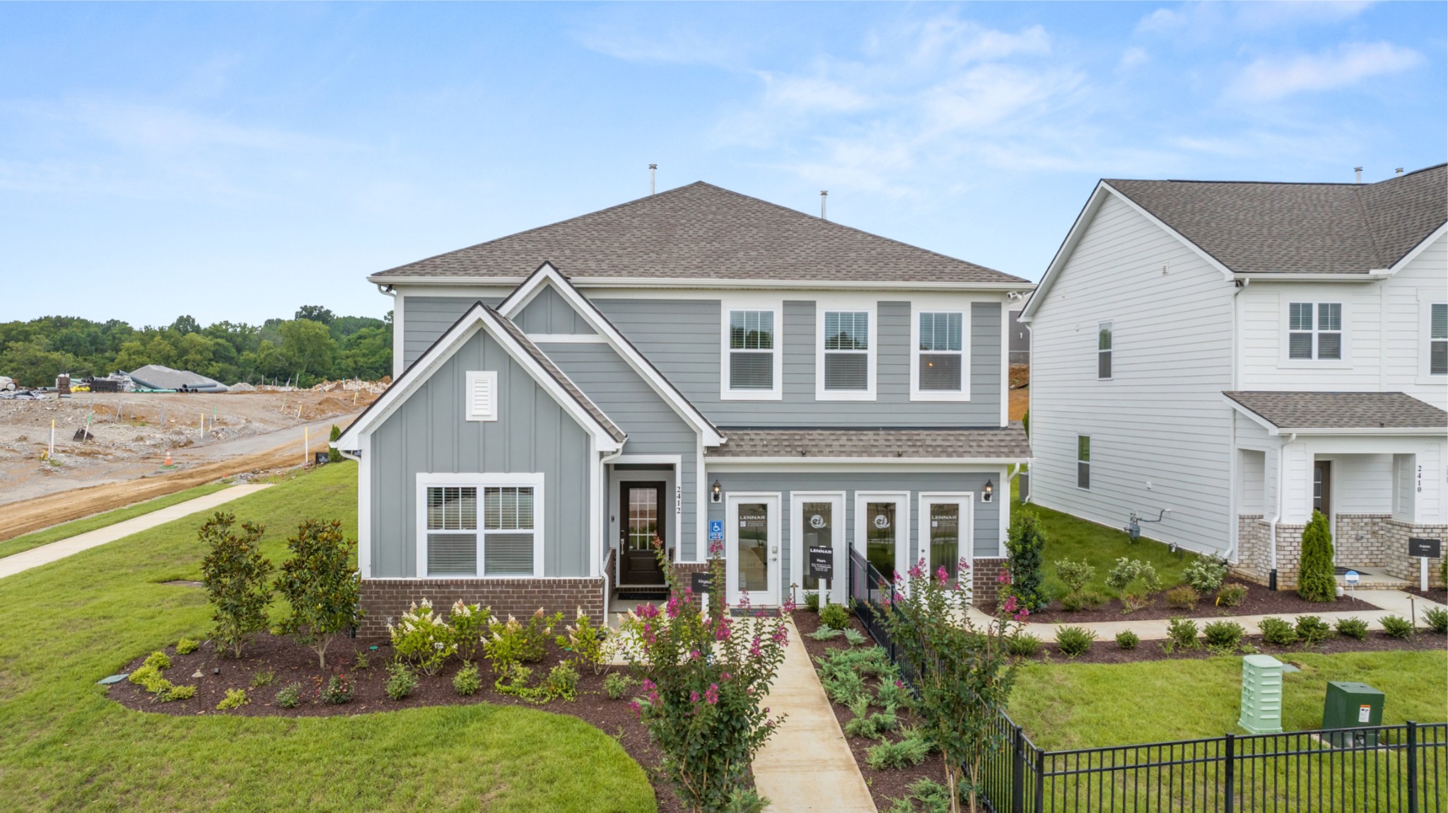 a front view of a house with a yard