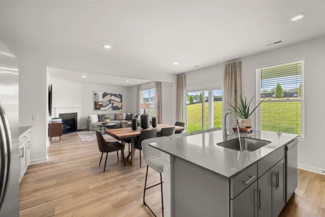 a view of a dining room with furniture and window