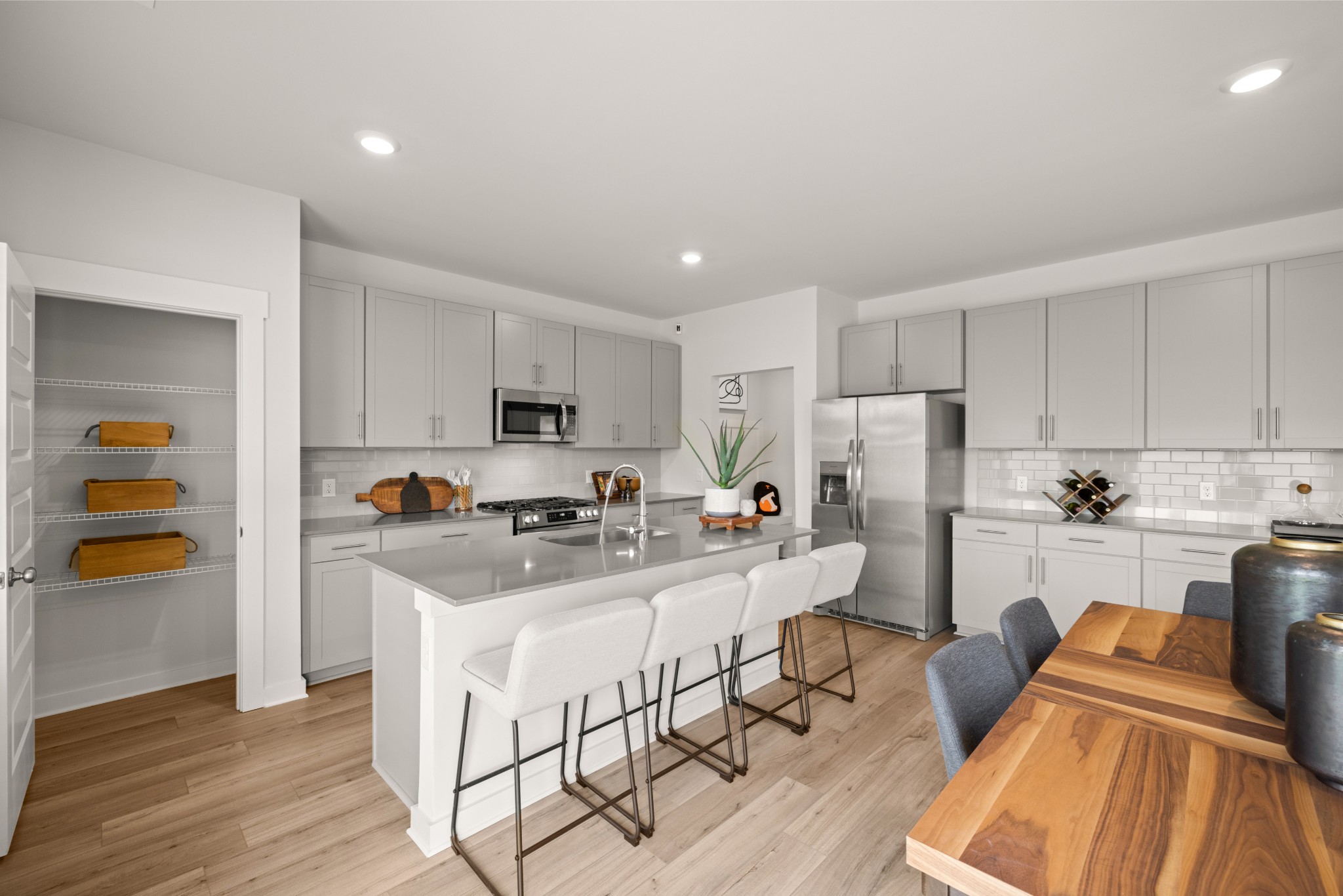 2412 Williams Rdg Drive Columbia, TN 38401 - Photo 16 of 54 a kitchen with stainless steel appliances a stove a sink a refrigerator white cabinets and wooden floor