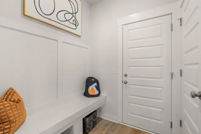 a view of an entryway with wooden floor and windows