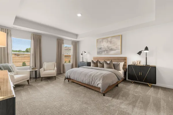 a bedroom with a bed and a painting on the wall