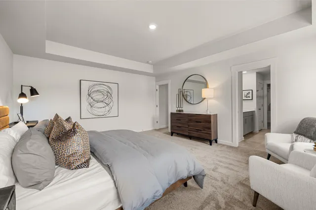 a bed room with a bed mirror and window