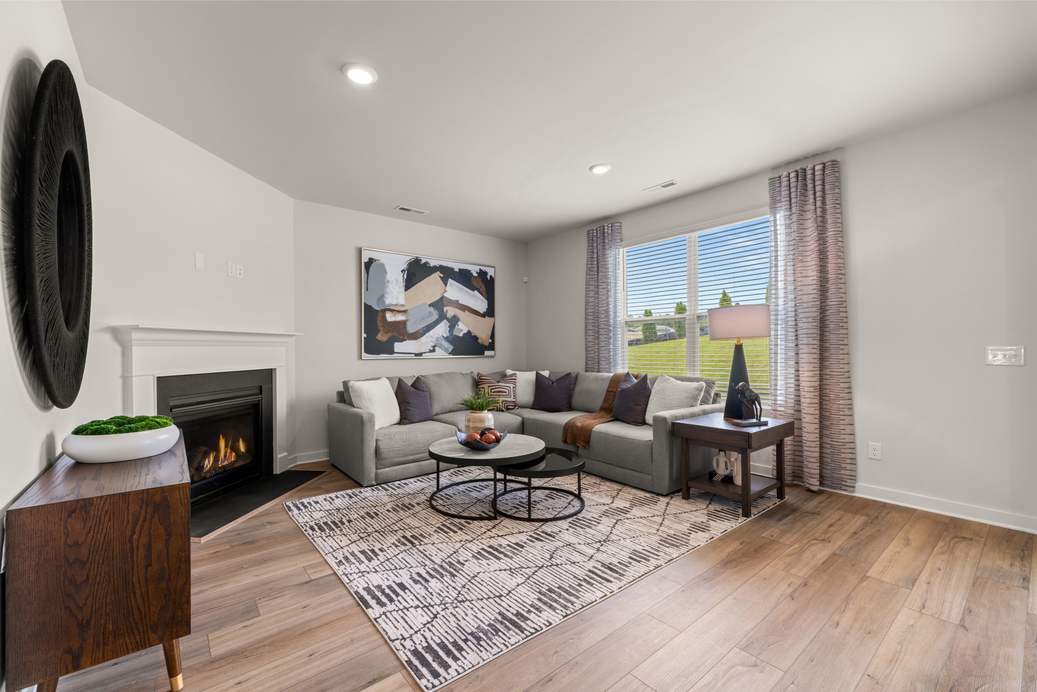 2412 Williams Rdg Drive Columbia, TN 38401 - Photo 9 of 54 a living room with furniture a fireplace and a wooden floor