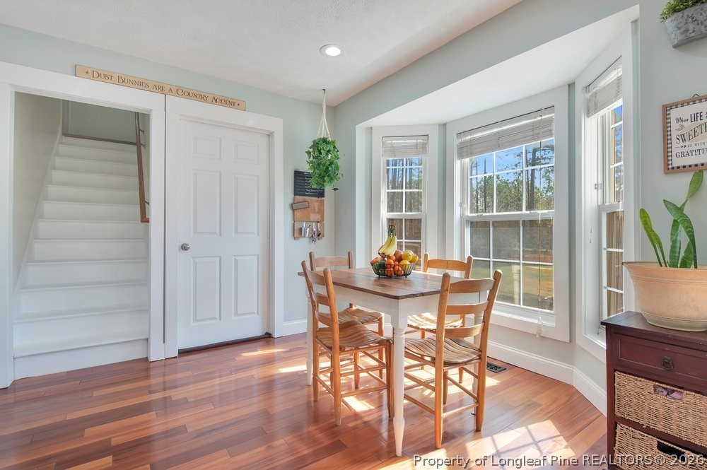419 Senter Lane Bunnlevel, NC 28323 - Photo 10 of 49 a view of a dining room with furniture and wooden floor