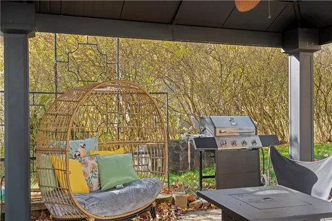 a balcony with table and chairs