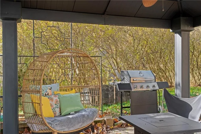 a balcony with table and chairs