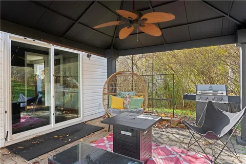 a backyard of a house with outdoor seating