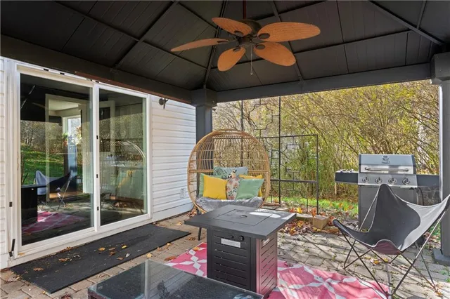 a backyard of a house with outdoor seating