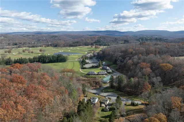 a view of a lake with green field