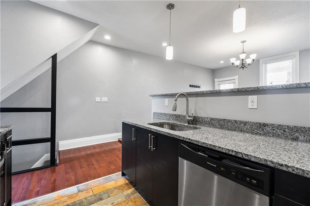 2918 Spring Street Pittsburgh, PA 15210 - Photo 9 of 25 a kitchen with a sink a counter space appliances and cabinets