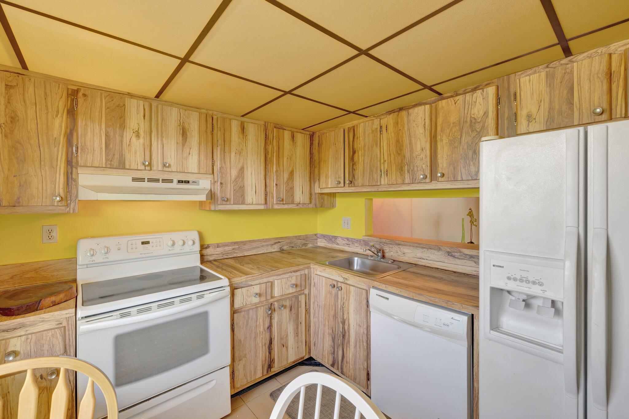 3301 Northwest 47th Terrace, Unit 410 Lauderdale Lakes, FL 33319 - Photo 16 of 58 a kitchen with a stove a refrigerator and a sink