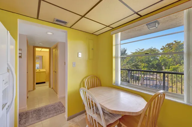 a view of an empty room with glass door