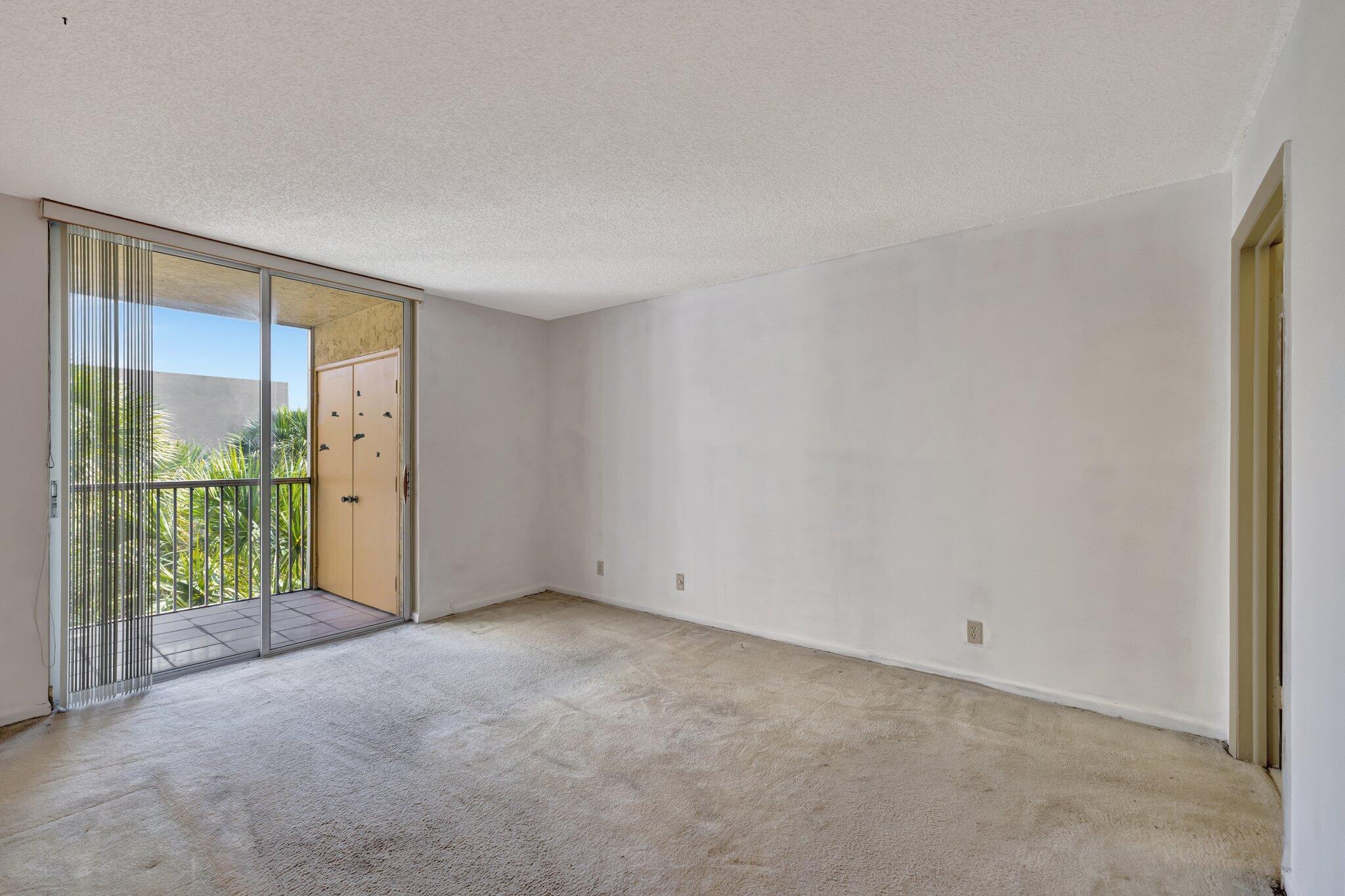 3301 Northwest 47th Terrace, Unit 410 Lauderdale Lakes, FL 33319 - Photo 21 of 58 a view of an empty room with glass door