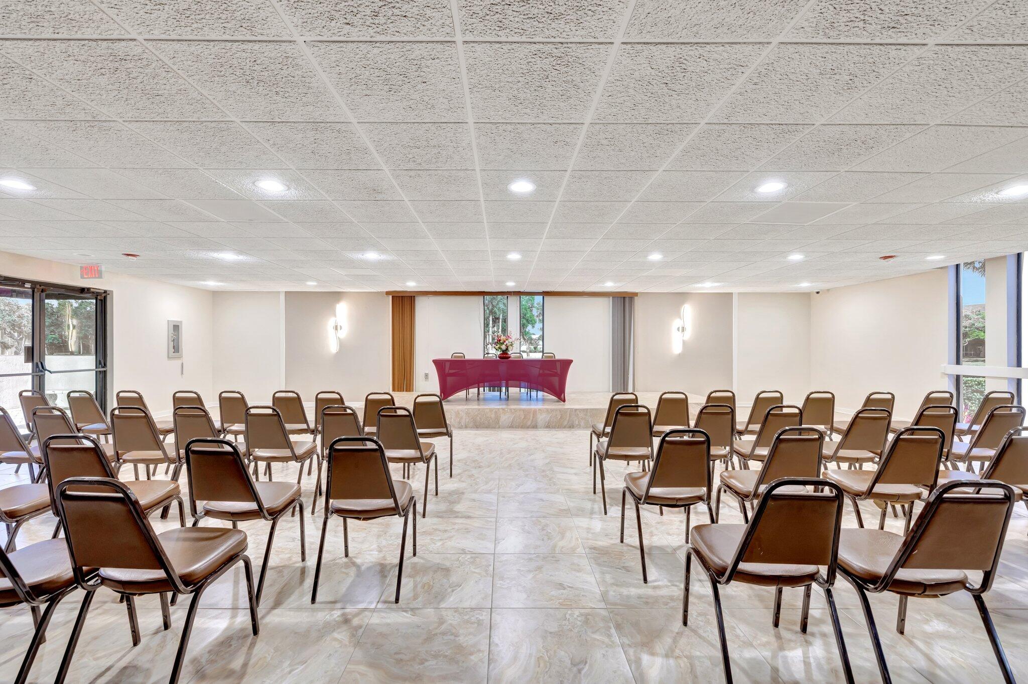3301 Northwest 47th Terrace, Unit 410 Lauderdale Lakes, FL 33319 - Photo 34 of 58 a group of people sitting at tables in a room