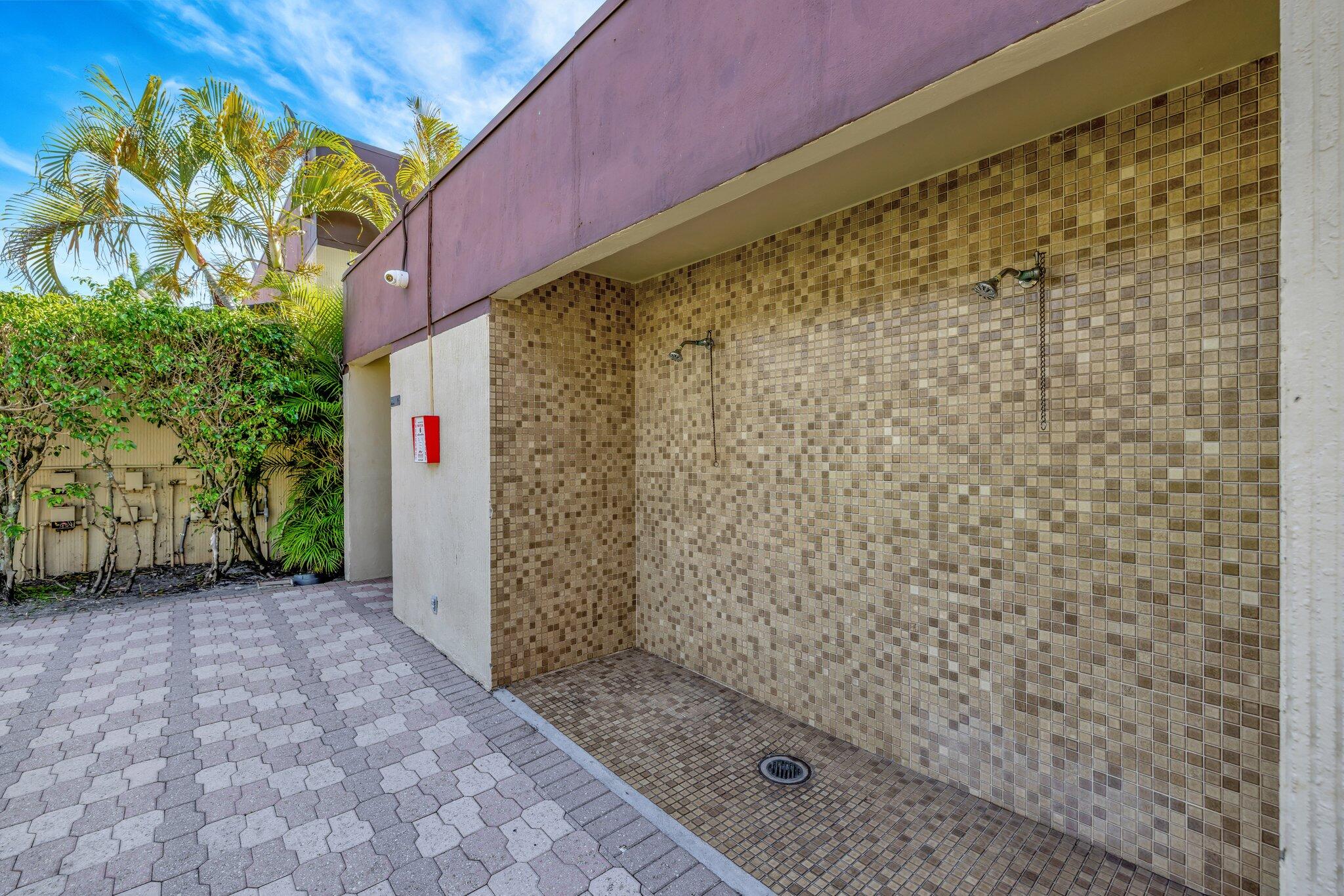 3301 Northwest 47th Terrace, Unit 410 Lauderdale Lakes, FL 33319 - Photo 49 of 58 a view of a bathroom with a shower