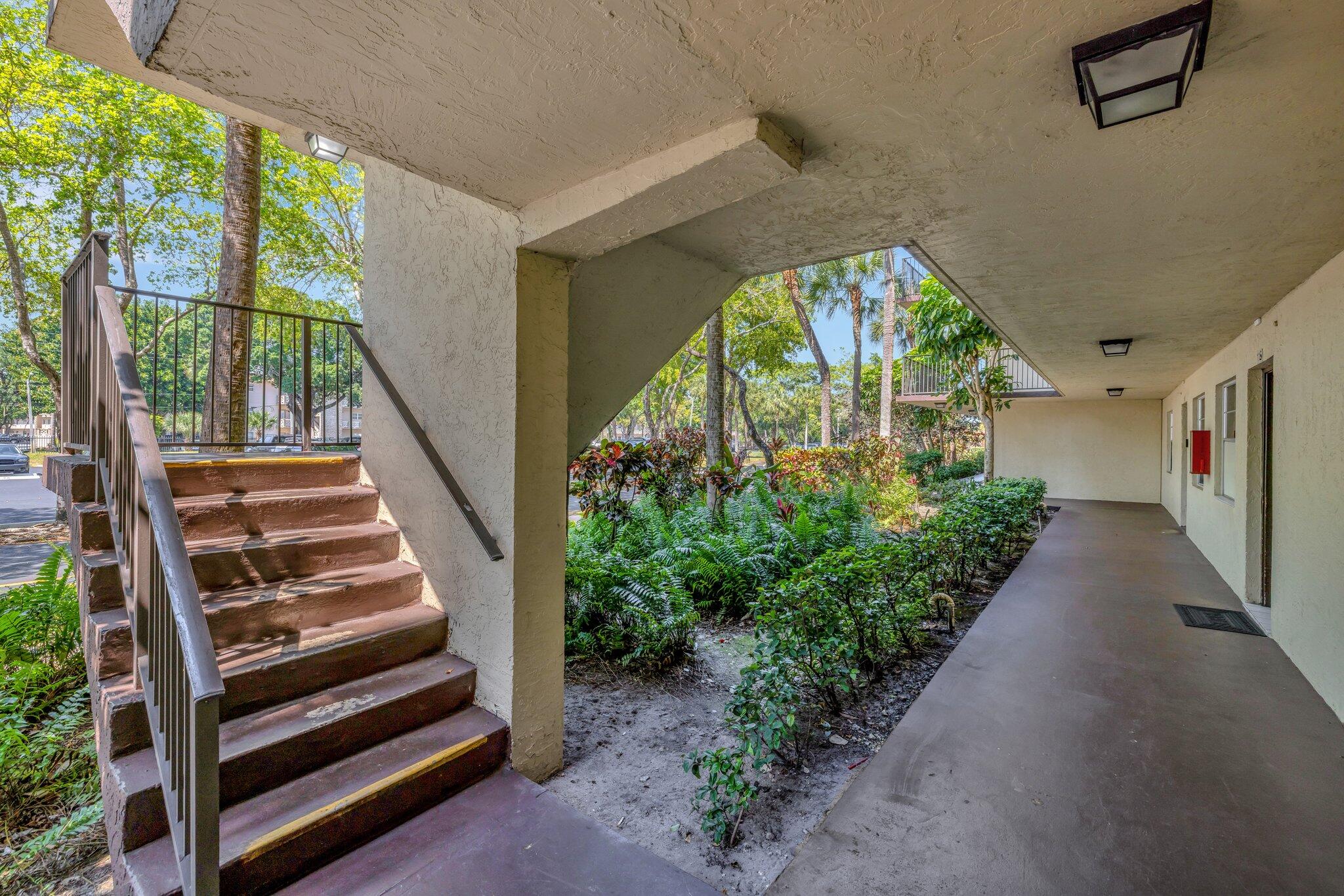 3301 Northwest 47th Terrace, Unit 410 Lauderdale Lakes, FL 33319 - Photo 6 of 58 a view of entryway with garden