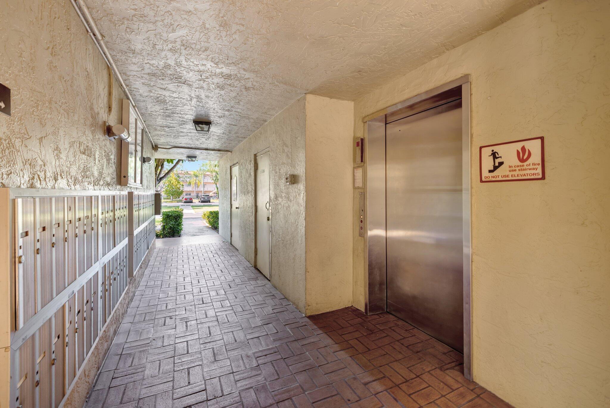 3301 Northwest 47th Terrace, Unit 410 Lauderdale Lakes, FL 33319 - Photo 7 of 58 a view of a hallway