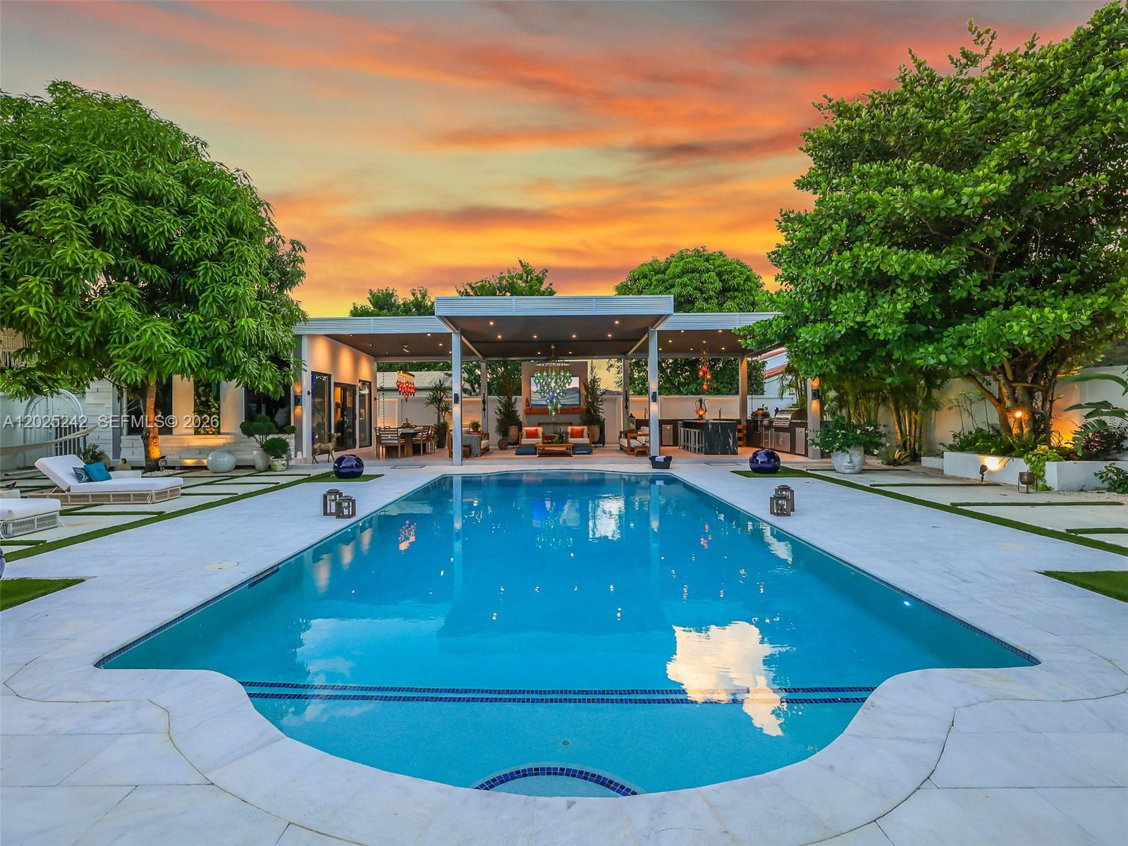 8761 Southwest 56th Street Miami, FL 33165 - Photo 53 of 90 a view of a patio with swimming pool table and chairs