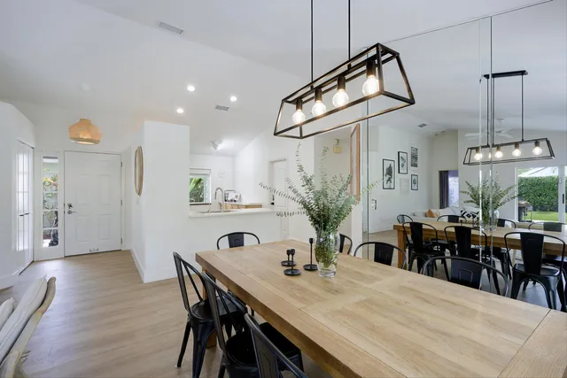 a view of a dining room with furniture window and outside view