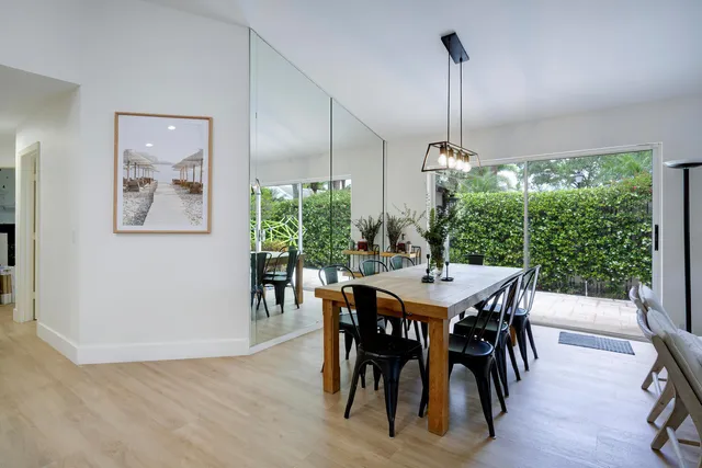 a kitchen with stainless steel appliances a stove refrigerator sink and cabinets