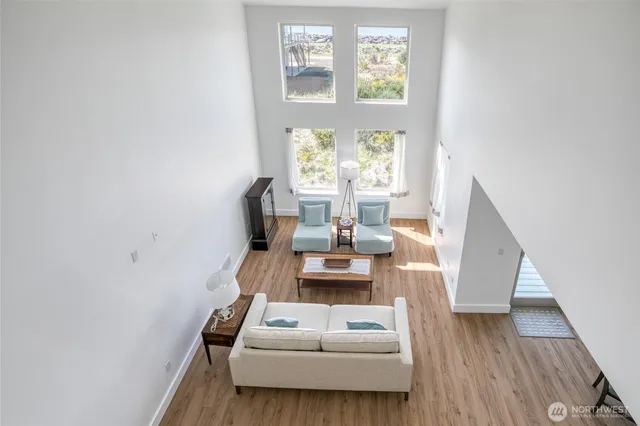 a view of a dining room with furniture and a window