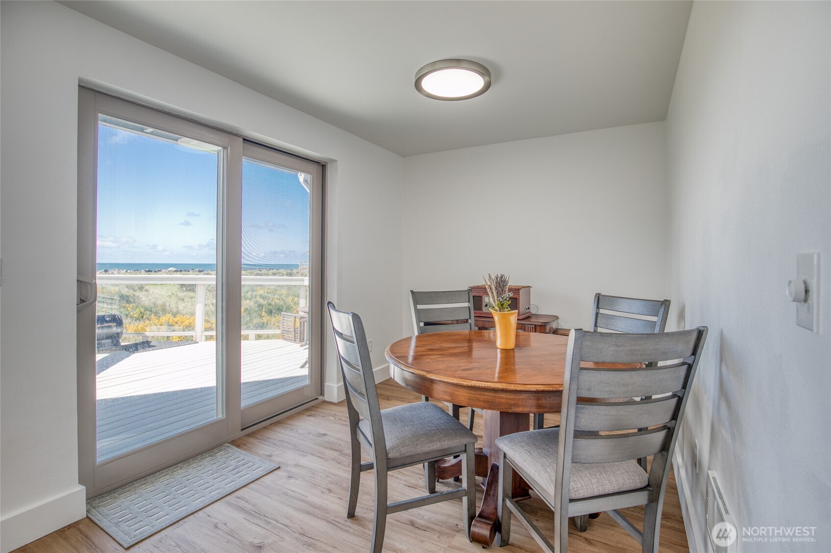 1472 Storm King Way Southwest, Unit A Ocean Shores, WA 98569 - Photo 14 of 39 a view of a dining room with furniture and a window
