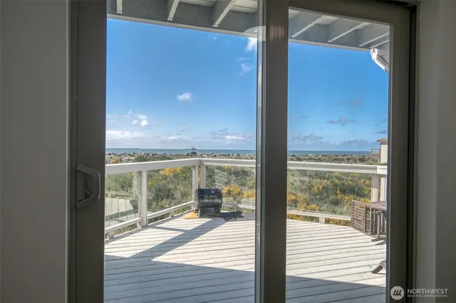 a view of a glass door and the balcony