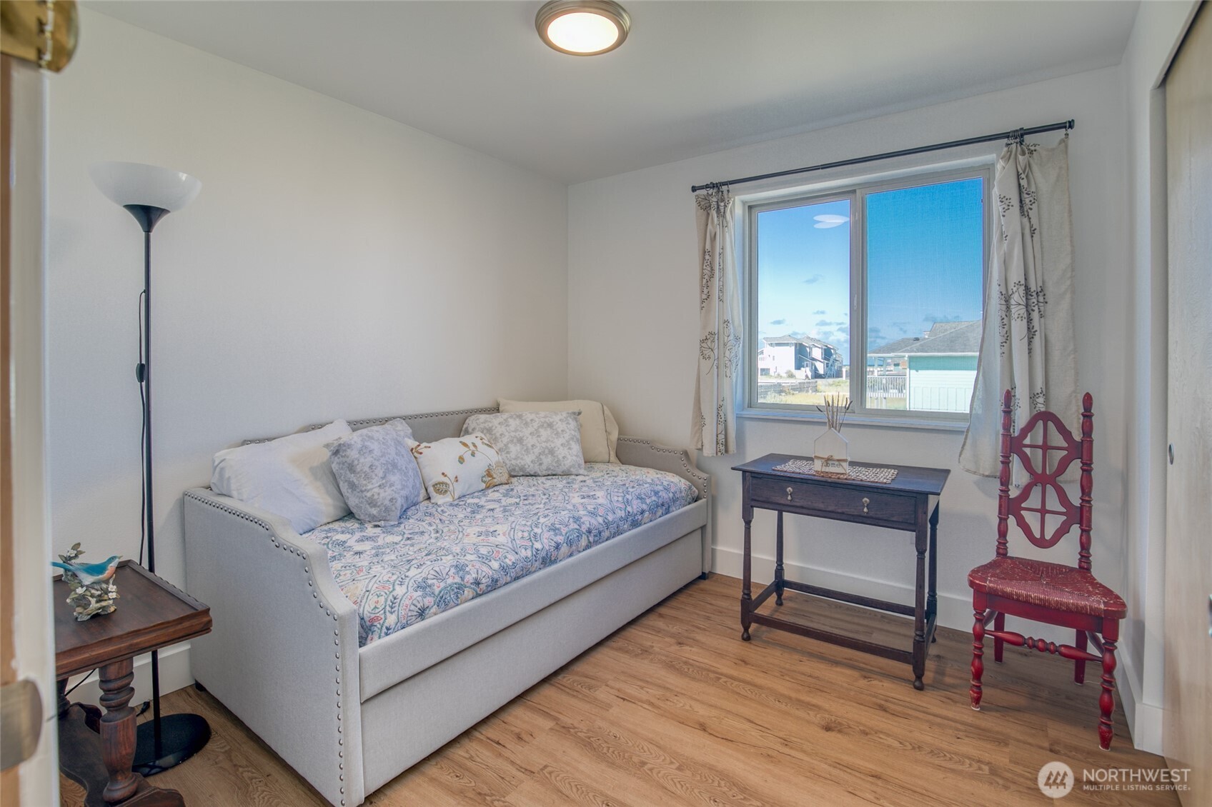 1472 Storm King Way Southwest, Unit A Ocean Shores, WA 98569 - Photo 24 of 39 a living room with furniture and a wooden floor