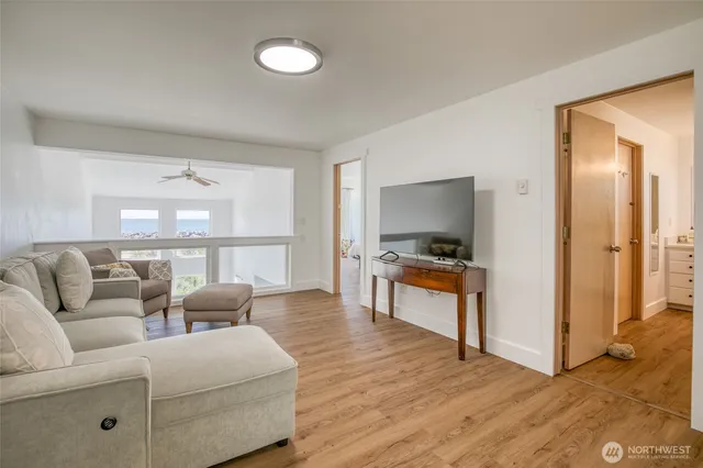 a living room with furniture and a lamp