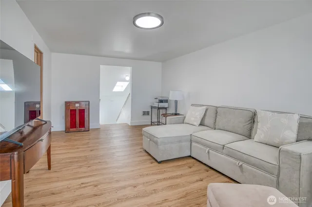 a living room with furniture and a table