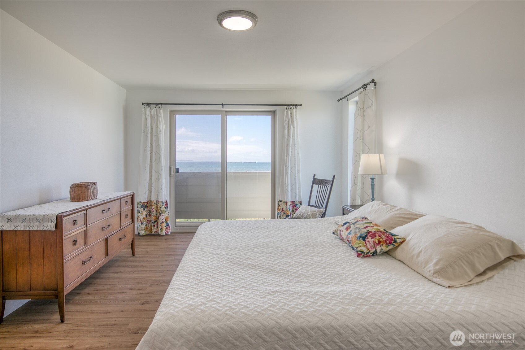 1472 Storm King Way Southwest, Unit A Ocean Shores, WA 98569 - Photo 29 of 39 a bedroom with a bed and a window