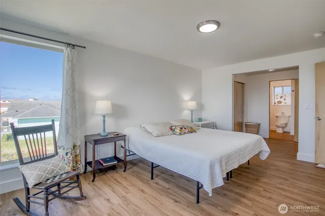 a bedroom with a bed and a view of bedroom