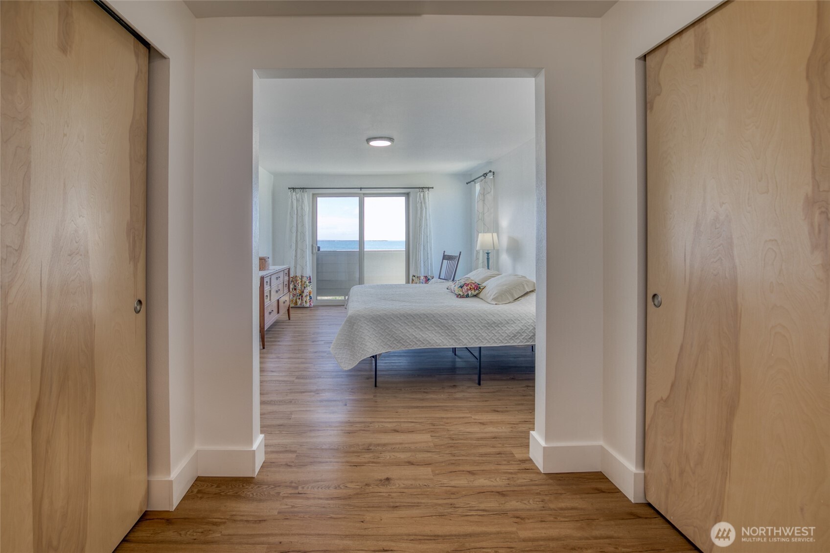 1472 Storm King Way Southwest, Unit A Ocean Shores, WA 98569 - Photo 31 of 39 a bedroom with a bed and a view of bedroom