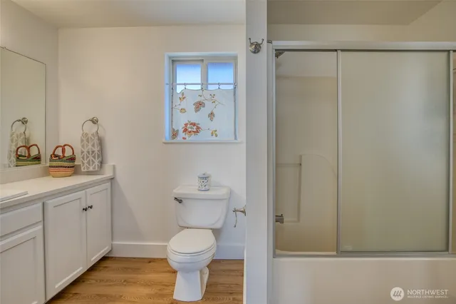 a view of a balcony with wooden floor and iron stairs