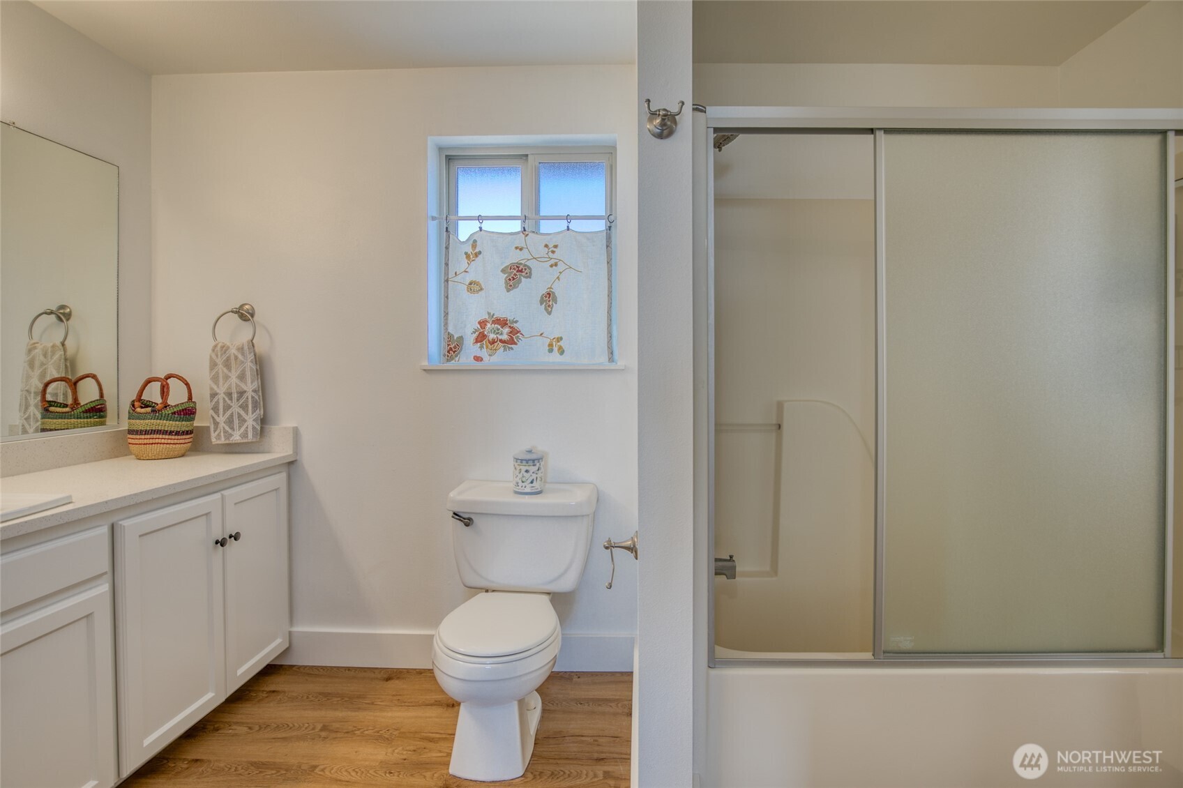 1472 Storm King Way Southwest, Unit A Ocean Shores, WA 98569 - Photo 33 of 39 a bathroom with a toilet sink and vanity