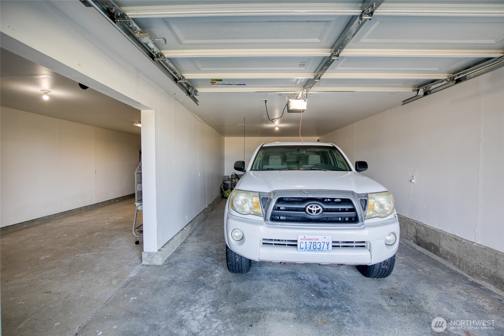 1472 Storm King Way Southwest, Unit A Ocean Shores, WA 98569 - Photo 37 of 39 a car parked in a garage