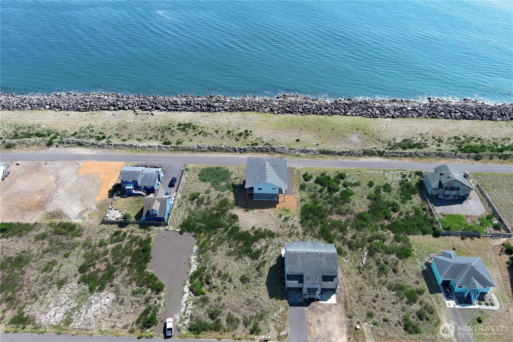 1472 Storm King Way Southwest, Unit A Ocean Shores, WA 98569 - Photo 39 of 39 an aerial view of a house with a yard