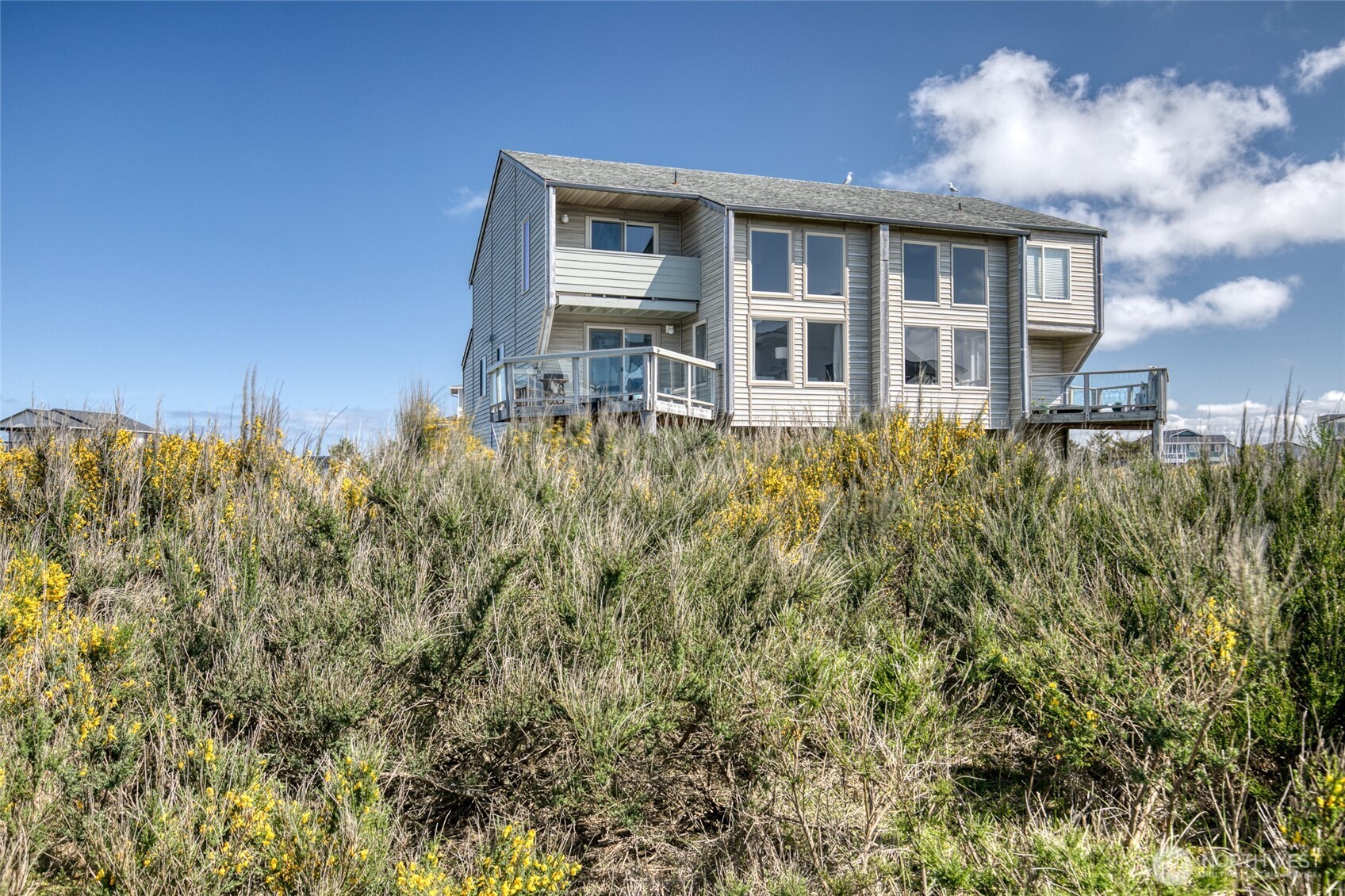 1472 Storm King Way Southwest, Unit A Ocean Shores, WA 98569 - Photo 7 of 39 a house view with a garden space